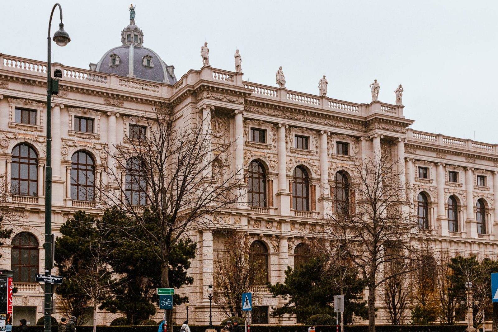 Ornate domed building with rooftop statues on Babenbergerstrasse in central Vienna